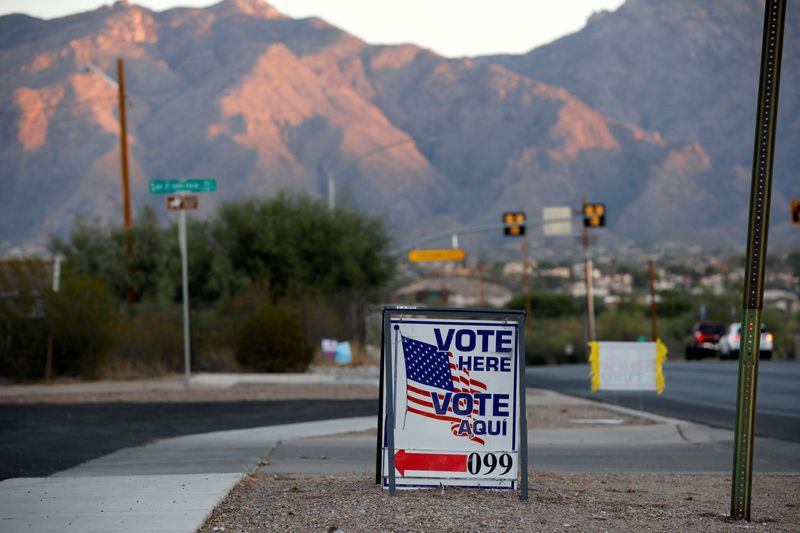 &copy; Reuters. FILE PHOTO: Sign directs voters to a polling station on Election Day in Tucson, Arizona, U.S. November 3, 2020.  REUTERS/Cheney Orr/File Photo