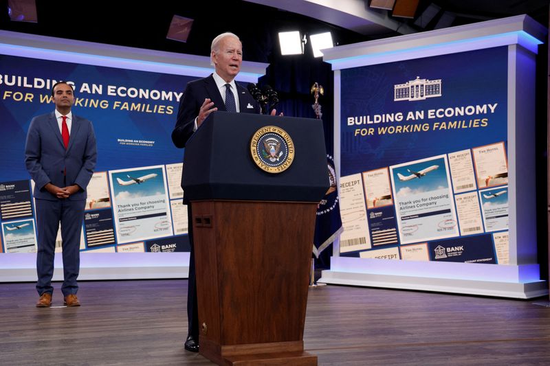 © Reuters. Rohit Chopra,?Director of the?Consumer Financial Protection Bureau, listens as U.S. President Joe Biden delivers remarks on the U.S. economy from an auditorium on the White House campus in Washington, U.S. October 26, 2022.  REUTERS/Jonathan Ernst