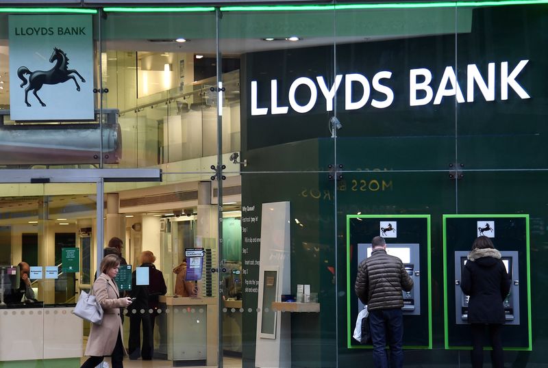 &copy; Reuters. FILE PHOTO: Customers use ATMs at a branch of Lloyds Bank in London, Britain, February 21, 2017. REUTERS/Toby Melville