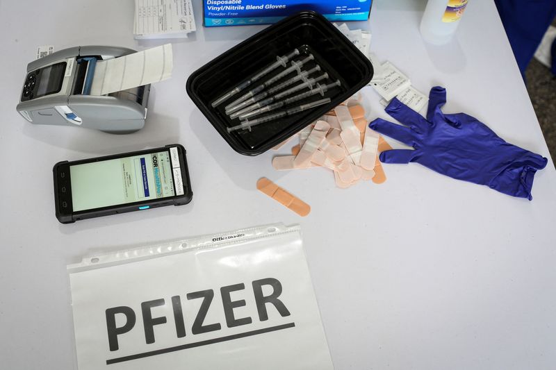 &copy; Reuters. FILE PHOTO: Doses of Pfizer coronavirus disease (COVID-19) vaccines are seen in a mass vaccination site supported by the federal government at the Miami Dade College North Campus in Miami, Florida, U.S., March 10, 2021. REUTERS/Marco Bello