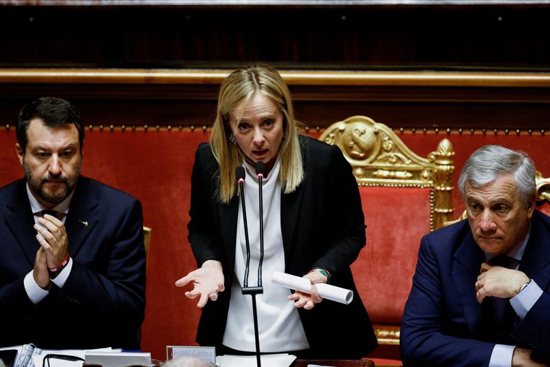 &copy; Reuters. Italy's Prime Minister Giorgia Meloni speaks next to Foreign Affairs Minister Antonio Tajani and Infrastructure Minister Matteo Salvini during a session of the upper house of parliament ahead of a confidence vote for the new government, in Rome, Italy, Oc