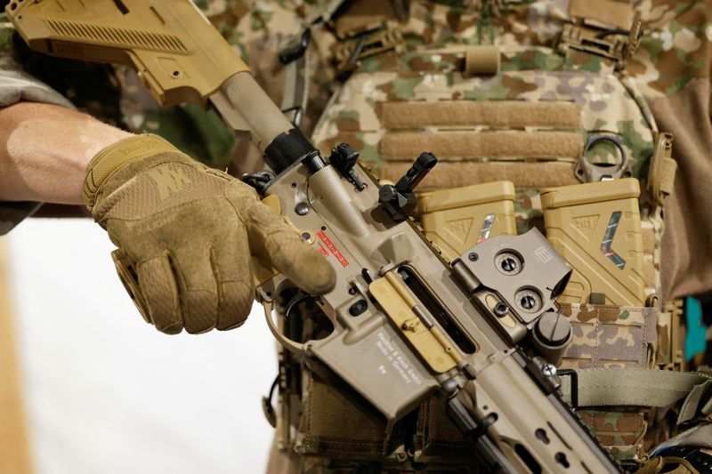 &copy; Reuters. FILE PHOTO: A soldier of the special forces unit KSK of Germany's army Bundeswehr holds the assault rifle G95/HK416 Heckler und Koch during a training exercise in Calw, Germany, October 24, 2022.  REUTERS/Heiko Becker/File Photo