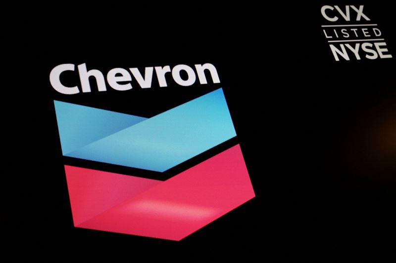 &copy; Reuters. The logo and trading information for Chevron is displayed on a screen on the floor of the New York Stock Exchange (NYSE) in New York City, U.S., June 27, 2022.  REUTERS/Brendan McDermid