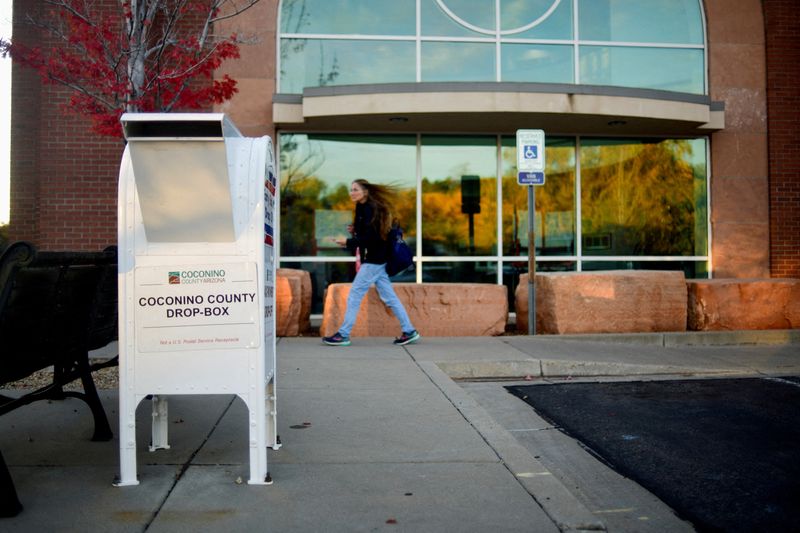 © Reuters. FILE PHOTO: A view of a Coconino County drop box which is used to accept early voting ballots outside the Coconino County Recorder's office, which has made several security improvements including boulders lining the building, in Flagstaff, Arizona, U.S., October 20, 2022.  REUTERS/Michael Patacsil/