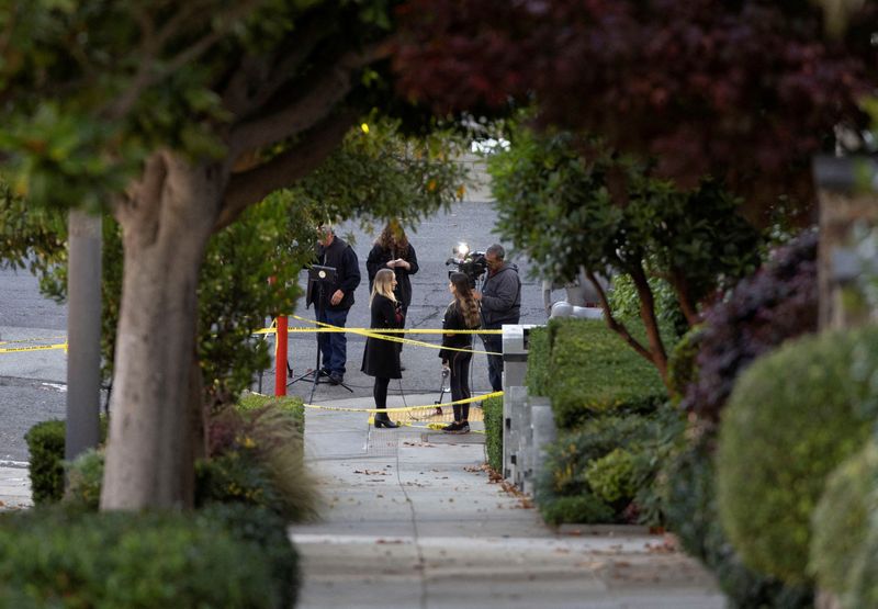 &copy; Reuters. Members of the media work next to police tape outside the home of U.S. House Speaker Nancy Pelosi where her husband Paul Pelosi was violently assaulted after a break-in at their house, according to a statement from her office, in San Francisco, California