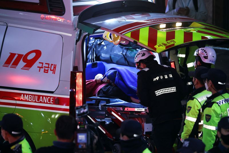 &copy; Reuters. A person receives medical help at the scene where dozens of people were injured in a stampede during a Halloween festival in Seoul, South Korea, October 29, 2022. REUTERS/Kim Hong-ji