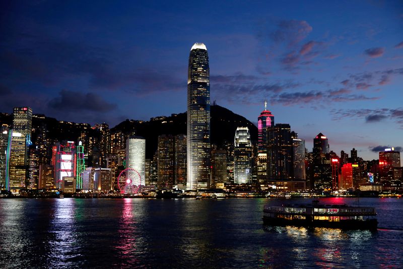 &copy; Reuters. FILE PHOTO: A Star Ferry boat crosses Victoria Harbour in front of a skyline of buildings during sunset. Hong Kong, China June 29, 2020. REUTERS/Tyrone Siu/File Photo