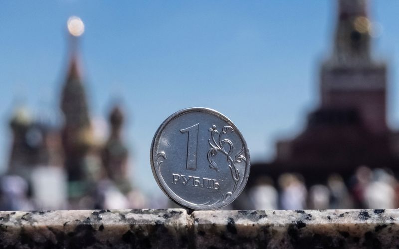 &copy; Reuters. FILE PHOTO: A Russian one rouble coin is pictured in front of a tower of the Kremlin and St. Basil's Cathedral in Moscow, Russia, in this illustration picture taken June 24, 2022. REUTERS/Maxim Shemetov/Illustration