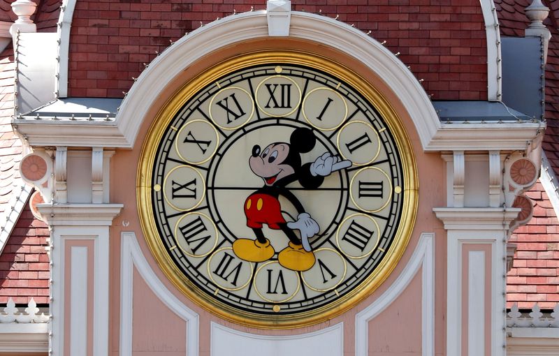 &copy; Reuters. FILE PHOTO: Disney character Mickey Mouse is seen on a clock at the entrance of Disneyland Paris, in Marne-la-Vallee, near Paris, July 9, 2020.   REUTERS/Charles Platiau