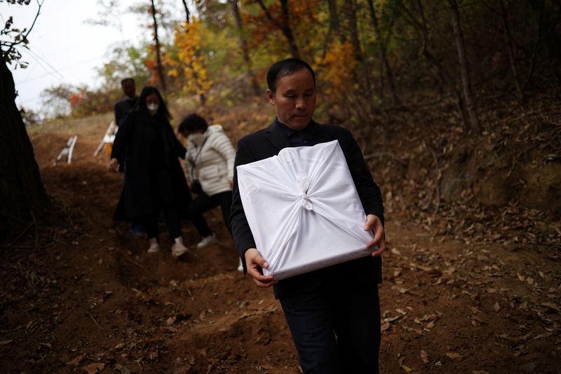 Grief-stricken and angry South Korean parents bid final goodbyes to Halloween disaster victims