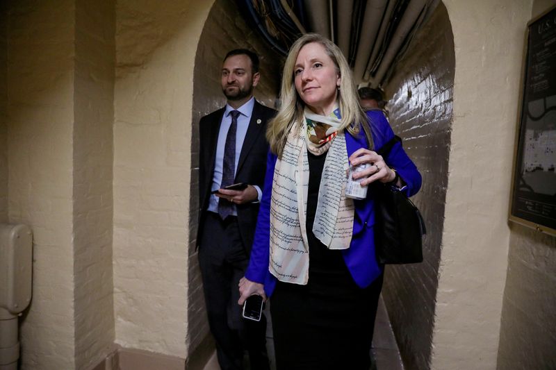 © Reuters. FILE PHOTO: U.S. .S. Representative Abigail Spanberger (D-VA) walks through an underground tunnel on her way to the House floor prior to the U.S. House of Representatives voting on two articles of impeachment against U.S. President Donald Trump on Capitol Hill in Washington, U.S., December 18, 2019. REUTERS/Jonathan Ernst/File Photo