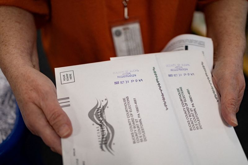 &copy; Reuters. FILE PHOTO: "On Demand" absentee or mail-in ballots are time stamped after being filled out in Doylestown, Pennsylvania, U.S. October 31, 2022. REUTERS/Hannah Beier/File Photo