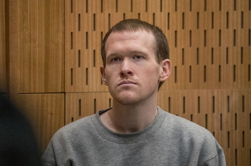&copy; Reuters. FILE PHOTO: Brenton Tarrant, the gunman who shot and killed worshippers in the Christchurch mosque attacks, listens as Crown prosecutor Mark Zarifeh delivers his submission during Tarrant's sentencing at the High Court in Christchurch, New Zealand, August