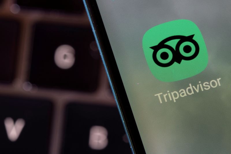 &copy; Reuters. FILE PHOTO: Tripadvisor app is seen on a smartphone in this illustration taken February 27, 2022. REUTERS/Dado Ruvic/Illustration