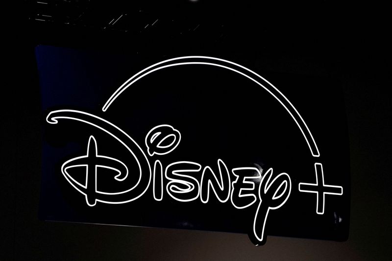 © Reuters. FILE PHOTO: Disney+ signage is seen above the convention floor at Comic-Con International in San Diego, California, U.S., July 21, 2022. REUTERS/Bing Guan/File Photo