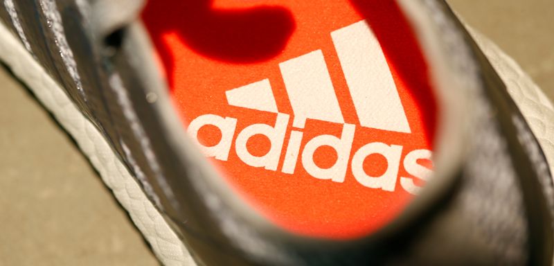 Adidas revises outlook, reports lower net income after Kanye West split