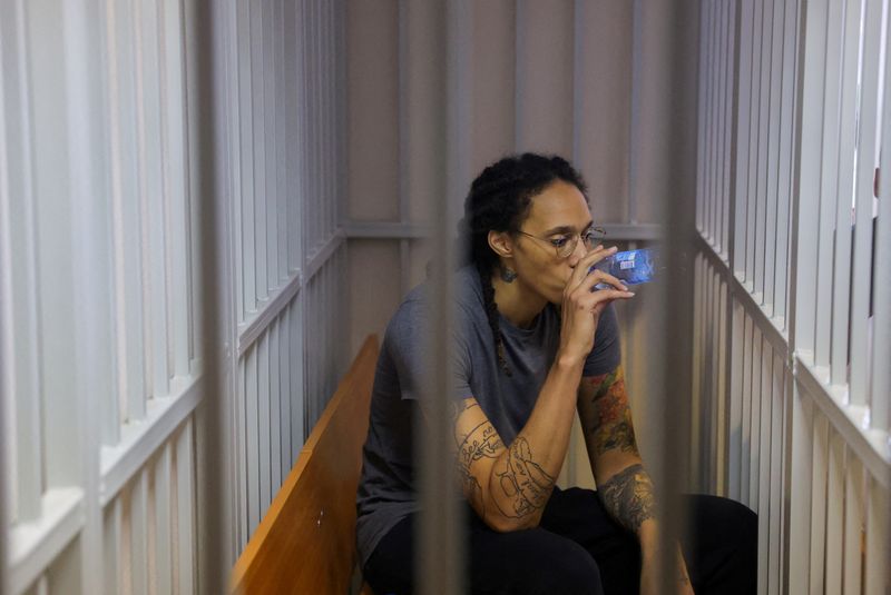 &copy; Reuters. FILE PHOTO: U.S. basketball player Brittney Griner, who was detained at Moscow's Sheremetyevo airport and later charged with illegal possession of cannabis, drinks water inside a defendants' cage after the court's verdict in Khimki outside Moscow, Russia 