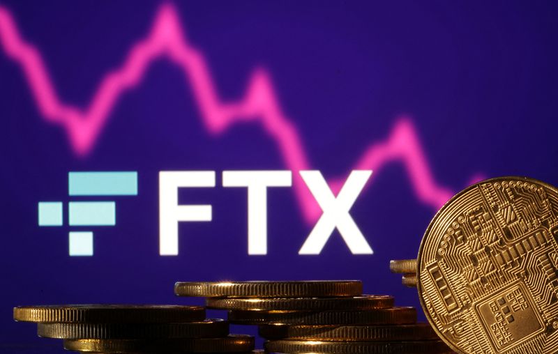 &copy; Reuters. Representations of cryptocurrencies are seen in front of displayed FTX logo and decreasing stock graph in this illustration taken November 10, 2022. REUTERS/Dado Ruvic/Illustration