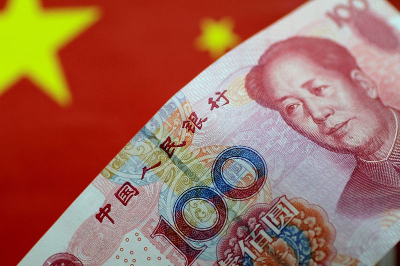 &copy; Reuters. FILE PHOTO: A China yuan note is seen in this illustration photo May 31, 2017.     REUTERS/Thomas White/Illustration/File Photo/File Photo