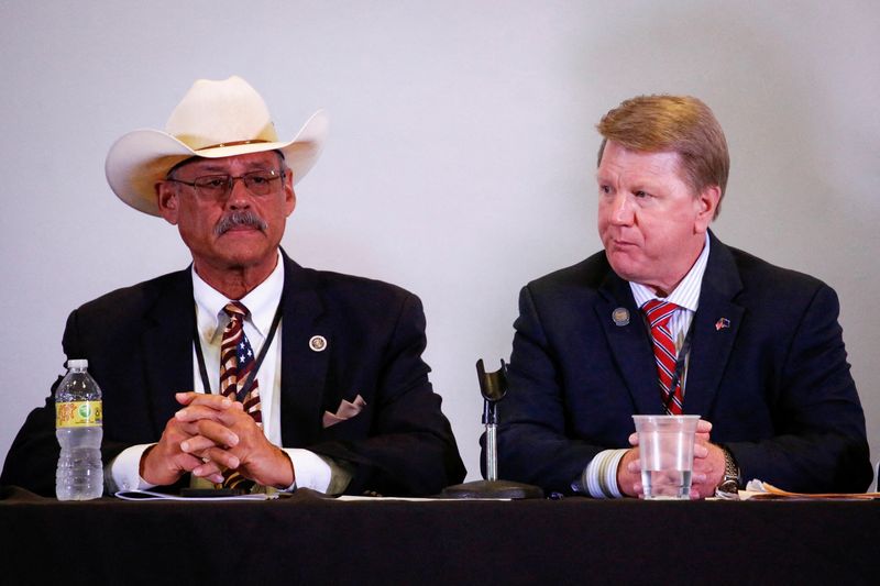 © Reuters. FILE PHOTO: Arizona's Republican secretary of state candidate Mark Finchem and Nevada's Republican secretary of state candidate Jim Marchant attend the Florida Election Integrity Public Hearing event, in West Palm Beach, Florida, U.S. September 10, 2022. REUTERS/Marco Bello/File Photo