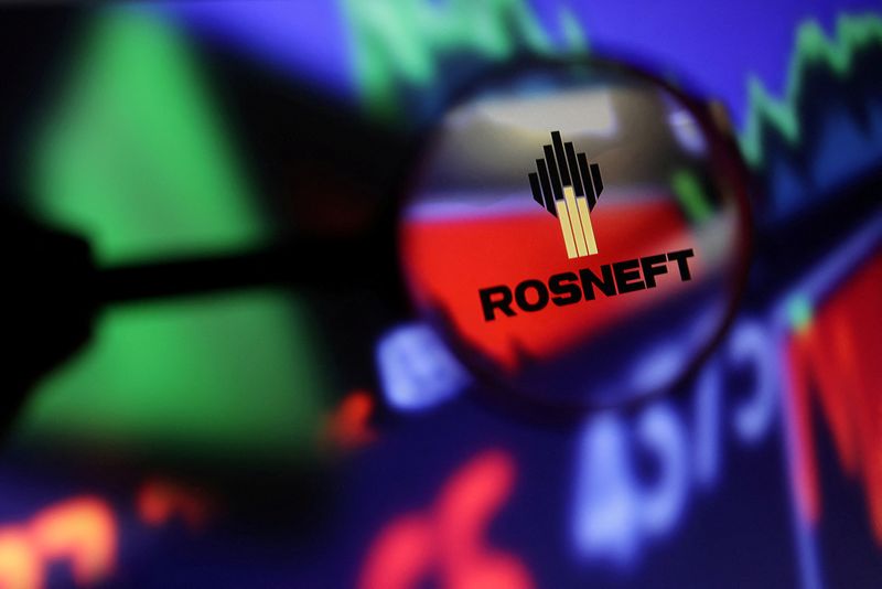 &copy; Reuters. FILE PHOTO: Rosneft logo and stock graph are seen through magnifier displayed in this illustration taken September 4, 2022. REUTERS/Dado Ruvic/Illustration