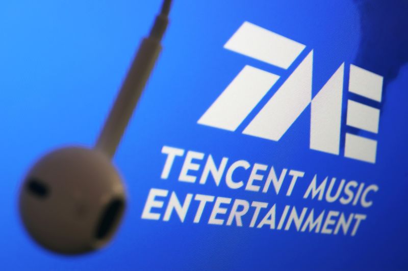 &copy; Reuters. The logo of China's Tencent Music Entertainment Group is seen next to an earphone in this illustration picture taken March 22, 2021. REUTERS/Florence Lo/Illustration