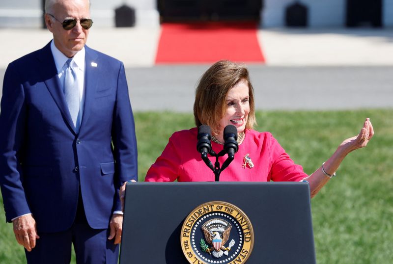 &copy; Reuters. FILE PHOTO: U.S. House of Representatives Speaker Nancy Pelosi speaks alongside U.S. President Joe Biden during an event to sign the CHIPS and Science Act of 2022, on the South Lawn of the White House in Washington, U.S., August 9, 2022. REUTERS/Evelyn Ho