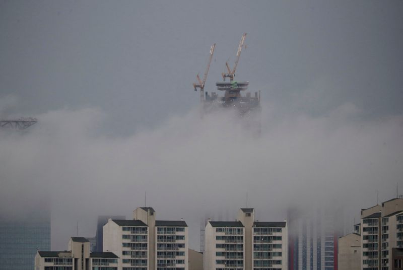 &copy; Reuters. FILE PHOTO: FILE PHOTO: A building which is currently under construction is seen above a fog during a rainy day in Seoul, South Korea, July 31, 2019.   REUTERS/Kim Hong-Ji