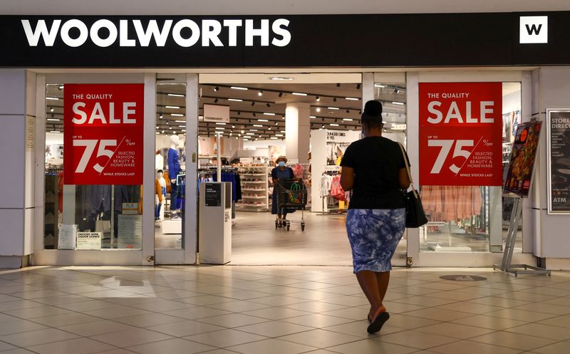 &copy; Reuters. FILE PHOTO: A shopper walks to a Woolworths store in Johannesburg, South Africa, March 2, 2022. REUTERS/Siphiwe Sibeko/File Photo