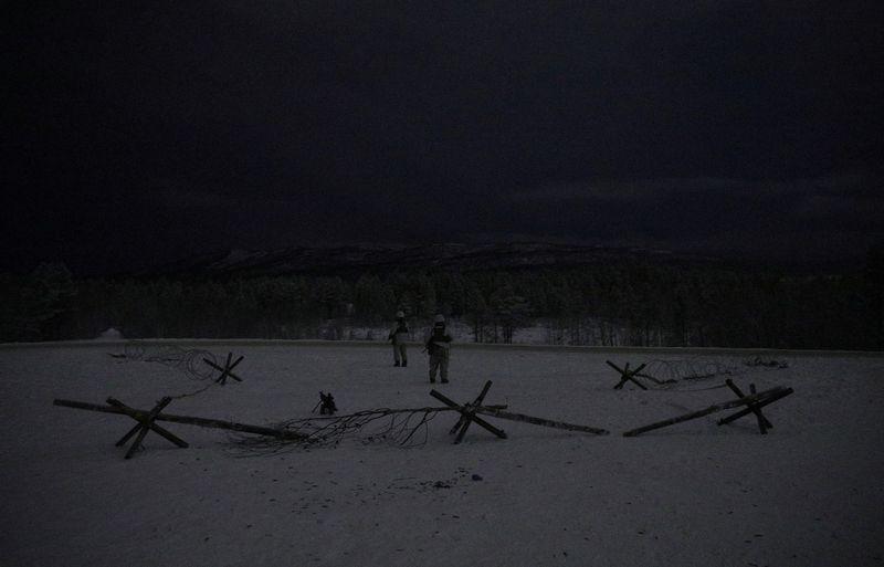 &copy; Reuters. FILE PHOTO: Norwegian soldiers stand guard in front of a temporary command centre camp during "Reindeer 2", a Norwegian-U.S. military drill, in Setermoen, Norway, October 29, 2019. REUTERS/Stoyan Nenov/File Photo