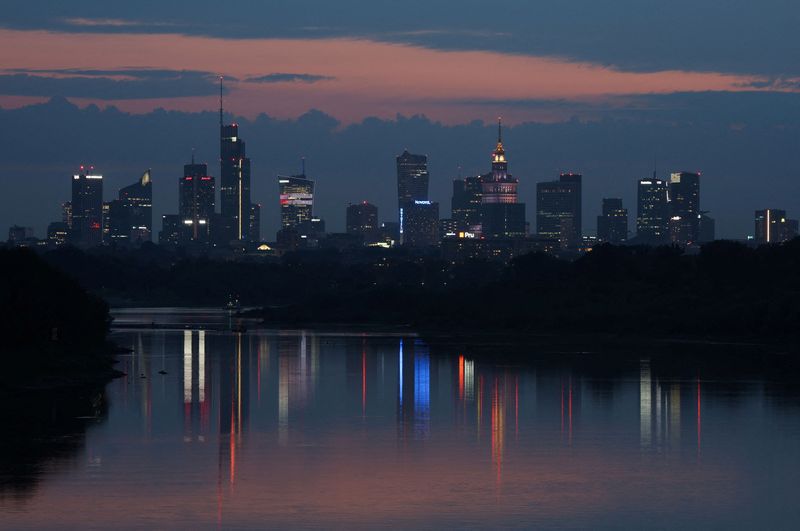 &copy; Reuters. FILE PHOTO: Skyline of skyscrapers reflected in Vistula river is seen after sunset in Warsaw, Poland August 22, 2022. REUTERS/Kacper Pempel/File Photo