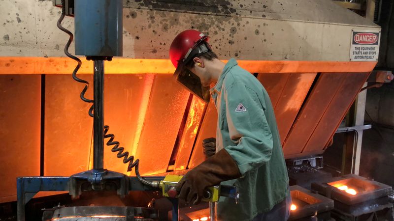 &copy; Reuters. FILE PHOTO: A worker pours hot metal at the Kirsh Foundry in Beaver Dam, Wisconsin, U.S., April 12, 2018. REUTERS/Timothy Aeppel/File Photo