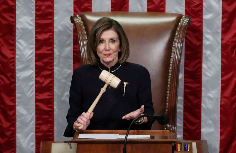 © Reuters. FILE PHOTO: U.S. Speaker of the House Nancy Pelosi (D-CA) wields the gavel as she presides over the House of Representatives approving two counts of impeachment against U.S. President Donald Trump in the House Chamber of the U.S. Capitol in Washington, U.S., December 18, 2019. REUTERS/Jonathan Ernst/File Photo