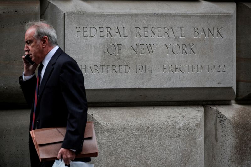 &copy; Reuters. FILE PHOTO: A man walks outside The Federal Reserve Bank of New York in New York City, U.S., October 12, 2021.  REUTERS/Brendan McDermid/File Photo