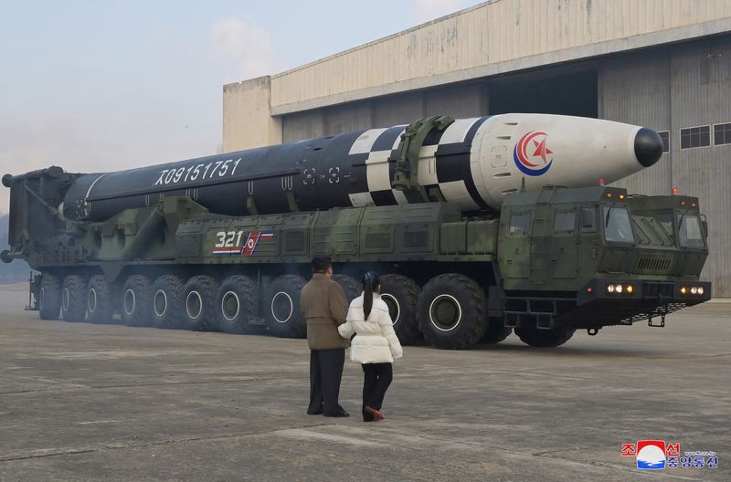 © Reuters. North Korean leader Kim Jong Un, along with his daughter, inspects an intercontinental ballistic missile (ICBM) in this undated photo released on November 19, 2022 by North Korea's Korean Central News Agency (KCNA). KCNA via REUTERS