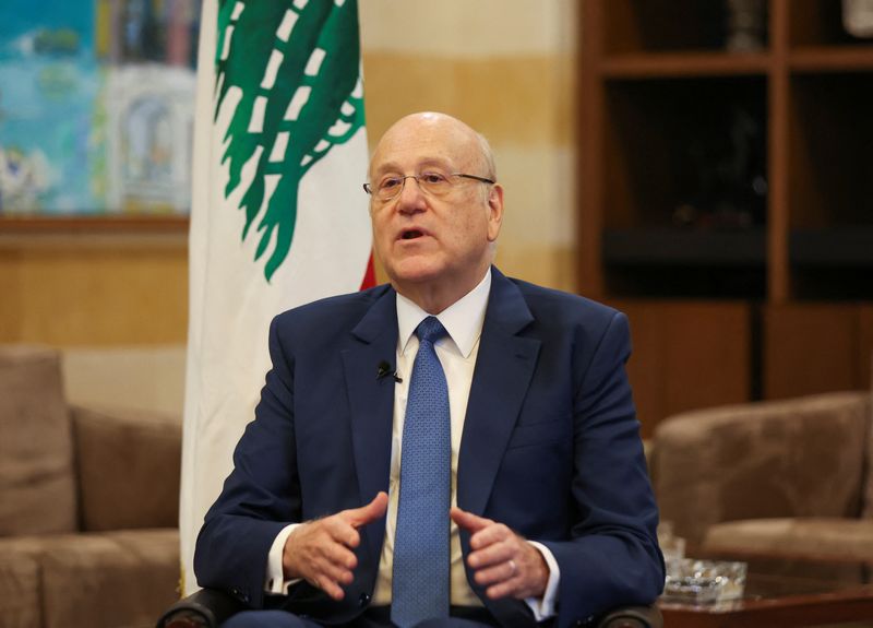 &copy; Reuters. FILE PHOTO: Lebanon's caretaker Prime Minister Najib Mikati gestures as he attends an interview with Reuters at the government headquarters in downtown Beirut, Lebanon September 30, 2022. REUTERS/Mohamed Azakir