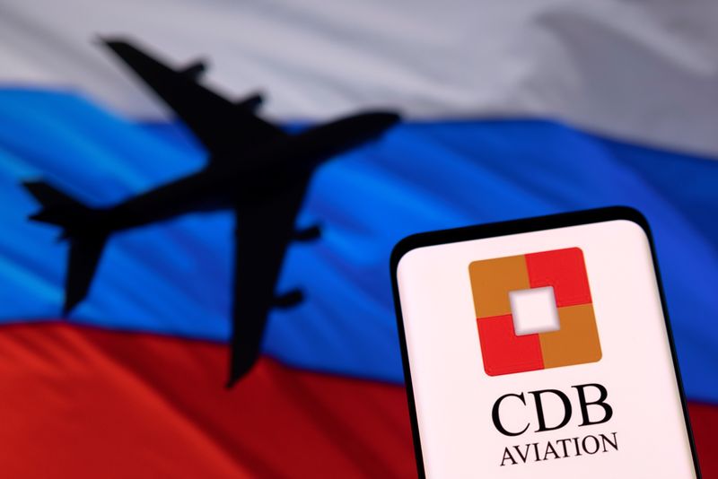 &copy; Reuters. CDB Aviation logo is seen displayed in front of the model of an airplane and a Russian flag in this illustration taken, May 4, 2022. REUTERS/Dado Ruvic/Illustration 