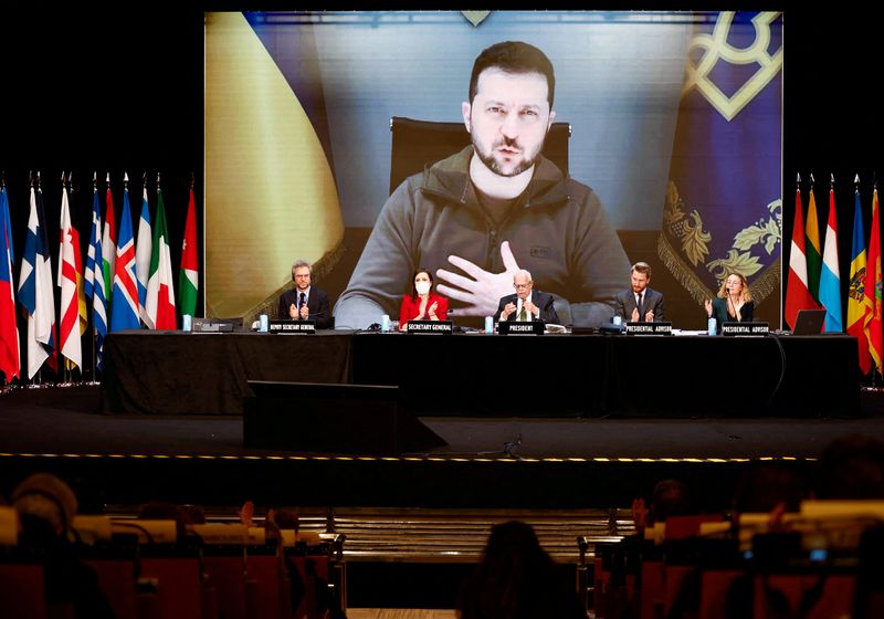 &copy; Reuters. FILE PHOTO: Ukraine's President Volodymyr Zelenskiy is seen on the screen as he speaks during the 68th Annual Session of the NATO Parliamentary Assembly in Madrid,  Spain, November 21, 2022. REUTERS/Juan Medina/File Photo