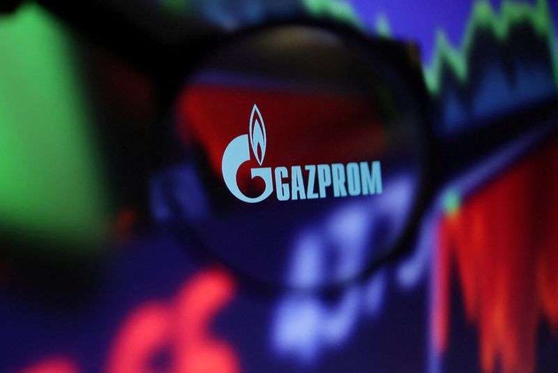 &copy; Reuters. FILE PHOTO: Gazprom logo and stock graph are seen through a magnifier displayed in this illustration taken September 4, 2022. REUTERS/Dado Ruvic/Illustration/File Photo