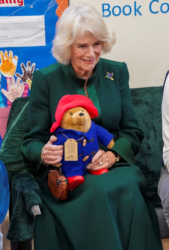 &copy; Reuters. Camilla, the Queen consort, smiles while holding a Paddington bear as she visits Barnardo's Nursery in Bow, London, Britain November 24, 2022. Arthur Edwards/Pool via REUTERS