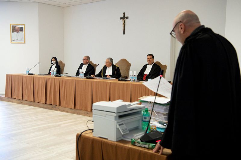 © Reuters. FILE PHOTO: A Vatican trial of 10 people accused of financial crimes, including Cardinal Angelo Becciu, resumes after a chief judge ordered the prosecution to give the defence more access to evidence and to question defendants who were not given the right to speak earlier, at the Vatican, November 17, 2021. Vatican Media/­Handout via REUTERS/File Photo