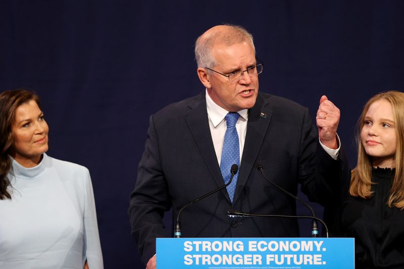 &copy; Reuters. FILE PHOTO: Incumbent Prime Minister Scott Morrison, leader of the Australian Liberal Party, stands next to his wife Jenny and daughter Abbey as he addresses supporters and concedes defeat in the country's general election in which he ran against Labor Pa