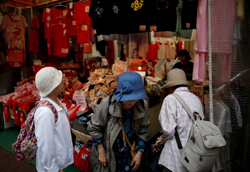 &copy; Reuters. FILE PHOTO: Women check items at a retail shop at Tokyo's Sugamo district, an area popular among the Japanese elderly, in Japan June 15, 2016. REUTERS/Issei Kato/File Photo      