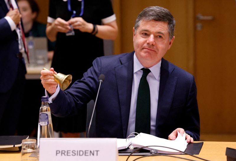 &copy; Reuters. FILE PHOTO: Irish Finance Minister and President of the Eurogroup Paschal Donohoe rings a bell at the start of the Eurozone finance ministers meeting in Brussels, Belgium, July 11, 2022. REUTERS/Yves Herman/File Photo