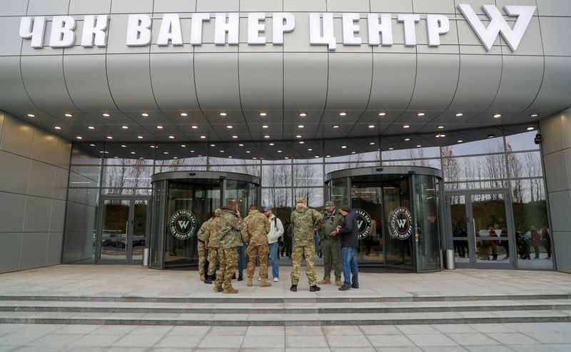 © Reuters. FILE PHOTO: Visitors gather outside PMC Wagner Centre, which is a project implemented by the businessman and founder of the Wagner private military group Yevgeny Prigozhin, during the official opening of the office block in Saint Petersburg, Russia, November 4, 2022. REUTERS/Igor Russak