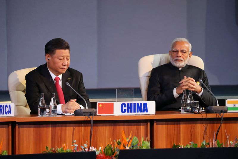 &copy; Reuters. FILE PHOTO: Indian Prime Minister Narendra Modi and China's President Xi Jinping attend the BRICS summit meeting in Johannesburg, South Africa, July 27, 2018. REUTERS/Mike Hutchings