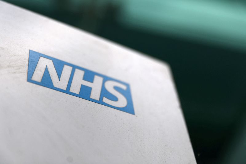 © Reuters. FILE PHOTO: An NHS logo is displayed outside a hospital in London, Britain May 14, 2017. REUTERS/Neil Hall/File Photo