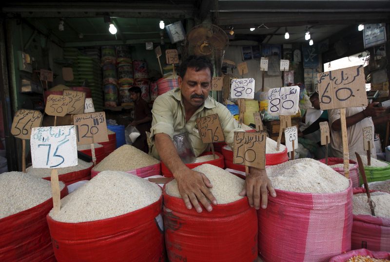 &copy; Reuters. A vendor arranges different types of rice, with their prices displayed, at his shop in a wholesale market in Karachi, Pakistan, June 1, 2015. REUTERS/Akhtar Soomro/Files