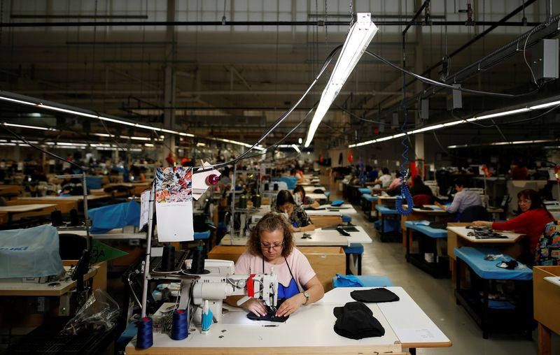 &copy; Reuters. FILE PHOTO: Workers make jackets at the Canada Goose factory in Toronto, Ontario, Canada, February 23, 2018.   REUTERS/Mark Blinch