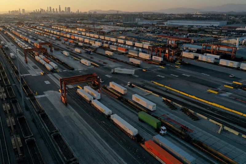 &copy; Reuters. FILE PHOTO: An aerial view of gantry cranes, shipping containers, and freight railway trains ahead of a possible strike if there is no deal with the rail worker unions, at the Union Pacific Los Angeles (UPLA) Intermodal Facility rail yard in Commerce, Cal